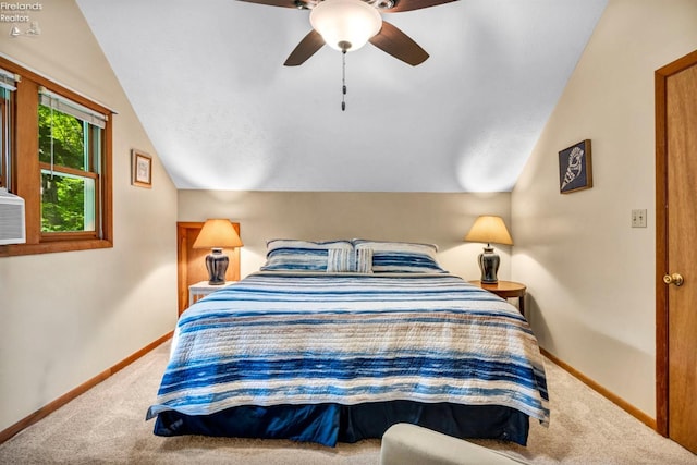 bedroom with ceiling fan, lofted ceiling, and carpet flooring