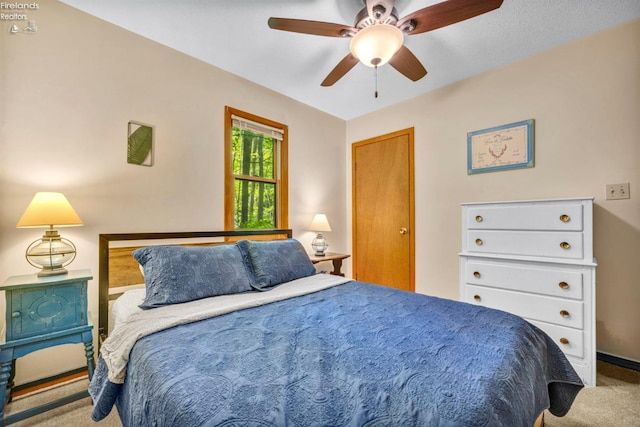 carpeted bedroom featuring ceiling fan