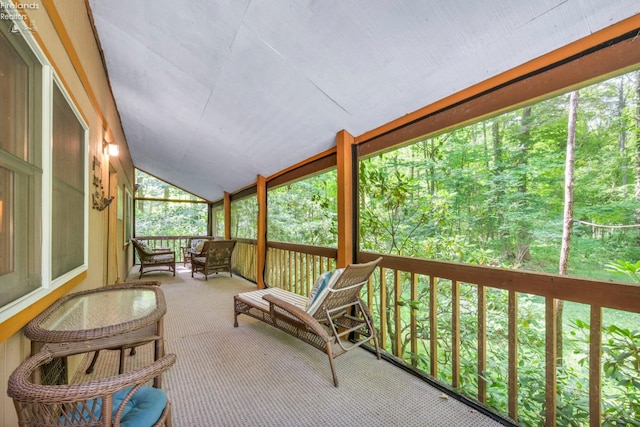 sunroom / solarium with vaulted ceiling