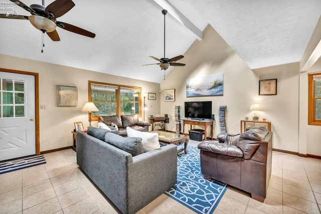 tiled living room featuring ceiling fan, a fireplace, and lofted ceiling