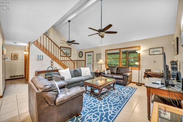 tiled living room with beamed ceiling, ceiling fan, and high vaulted ceiling