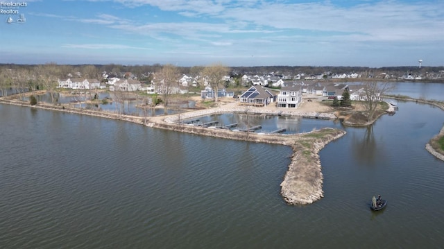 bird's eye view featuring a water view and a residential view