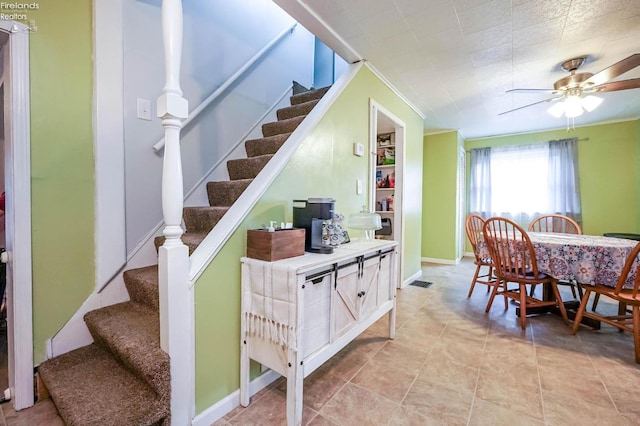 dining area featuring tile patterned flooring and ceiling fan