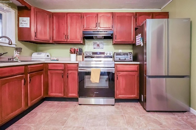 kitchen with extractor fan, stainless steel fridge, sink, light tile patterned floors, and electric range