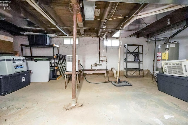 basement with refrigerator and water heater