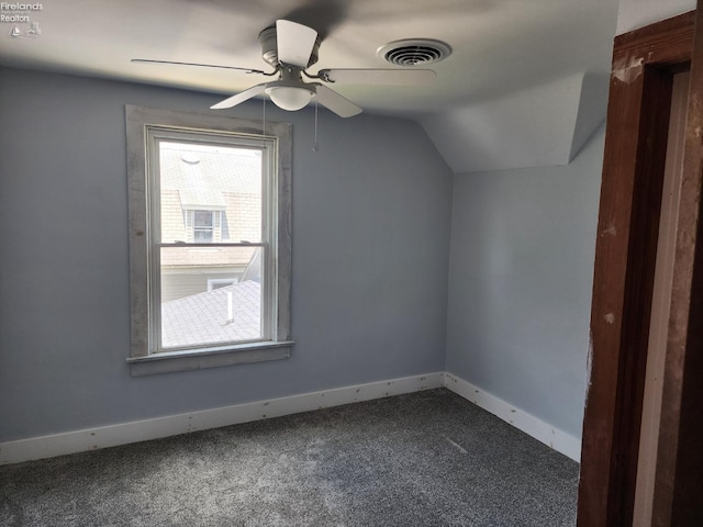 additional living space featuring lofted ceiling, ceiling fan, and carpet