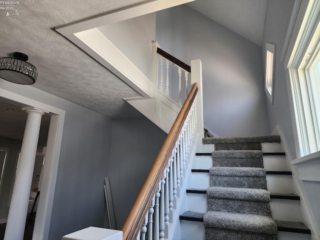 stairs featuring ornate columns