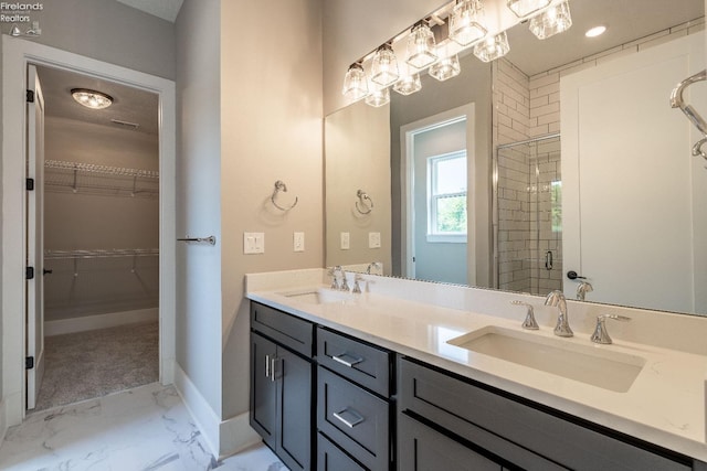 bathroom featuring vanity and a shower with shower door