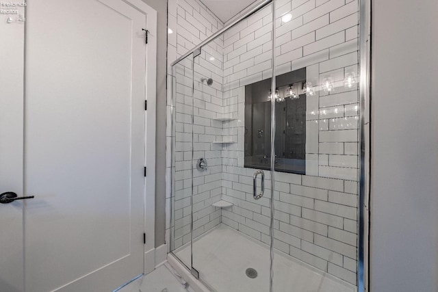 bathroom with a shower with shower door