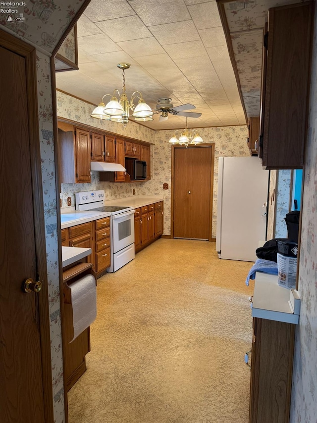 1225 White Ave, Fremont, OH 43420 - kitchen with white appliances, brown cabinetry, an inviting chandelier, and wallpapered walls
