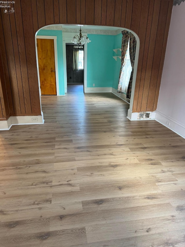 1225 White Ave, Fremont, OH 43420 - interior space featuring arched walkways, a notable chandelier, wooden walls, wood finished floors, and visible vents