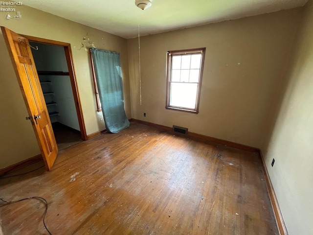 unfurnished bedroom featuring wood-type flooring