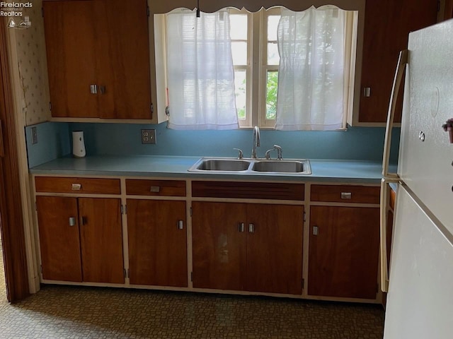 kitchen featuring sink and white refrigerator