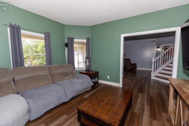 living room featuring dark hardwood / wood-style flooring