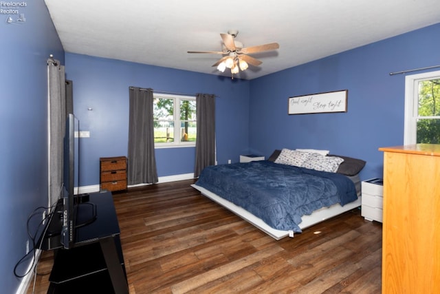 bedroom featuring dark hardwood / wood-style flooring and ceiling fan