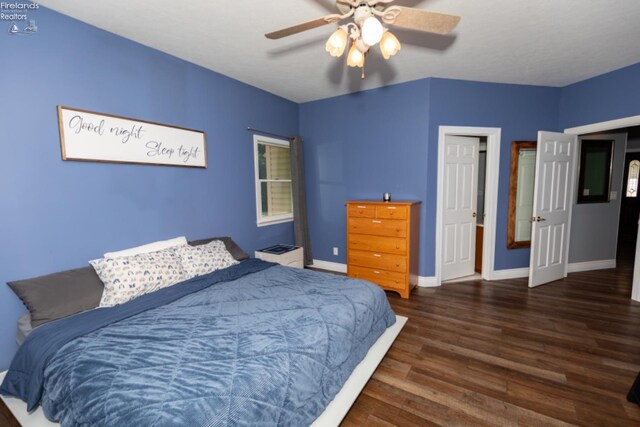 bedroom with hardwood / wood-style floors and ceiling fan