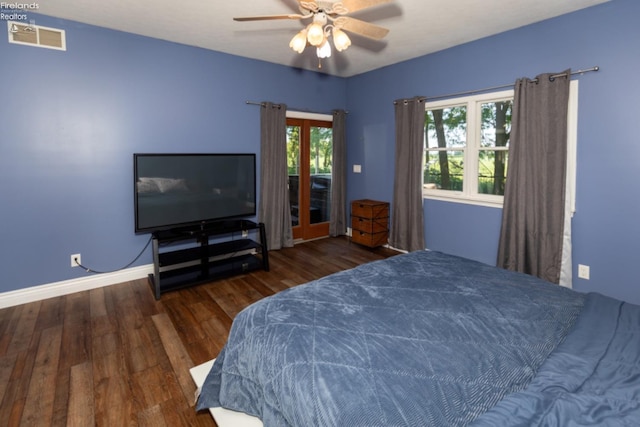 bedroom with dark wood-type flooring, access to outside, and ceiling fan