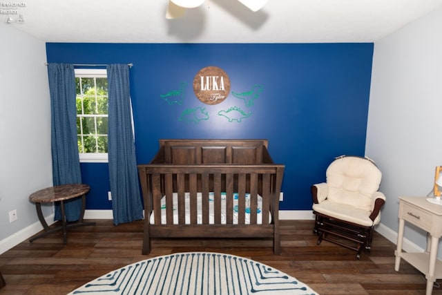 bedroom with ceiling fan and dark wood-type flooring