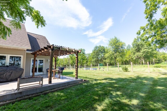 view of yard with a patio and a pergola