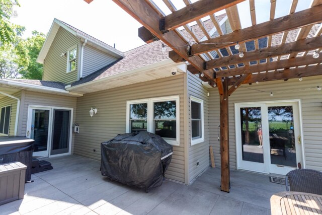 view of patio / terrace with grilling area and a pergola