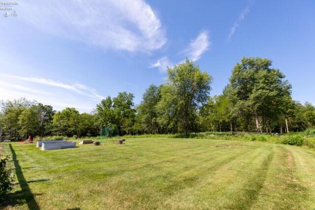 view of yard with a rural view