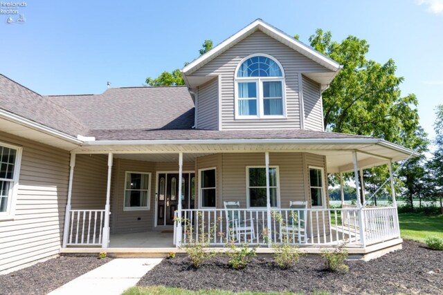 farmhouse-style home with covered porch