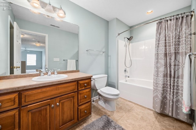 full bathroom featuring vanity, shower / bath combo with shower curtain, tile patterned flooring, and toilet