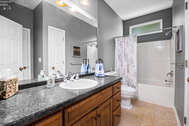 full bathroom with vanity, shower / tub combo, tile patterned flooring, and toilet