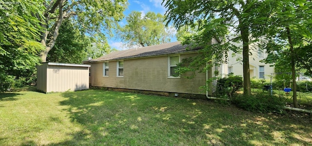 view of property exterior with a storage shed and a yard