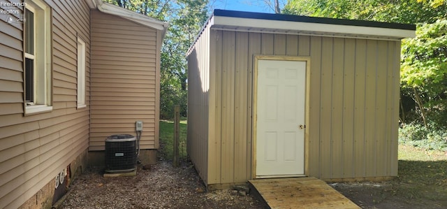 view of outbuilding with central air condition unit