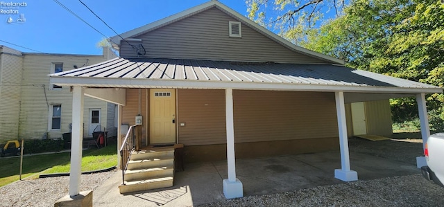 rear view of house featuring a carport