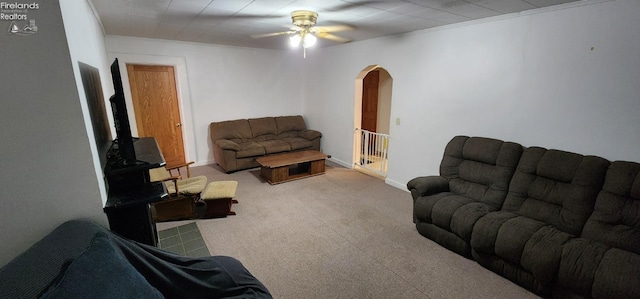 living room featuring ceiling fan and light colored carpet