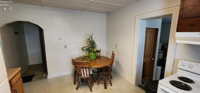 dining room featuring a drop ceiling