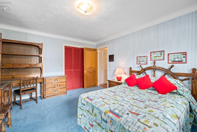 bedroom featuring a closet and carpet floors