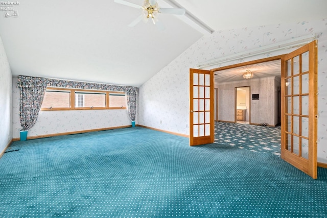 carpeted spare room featuring french doors, ceiling fan, and lofted ceiling