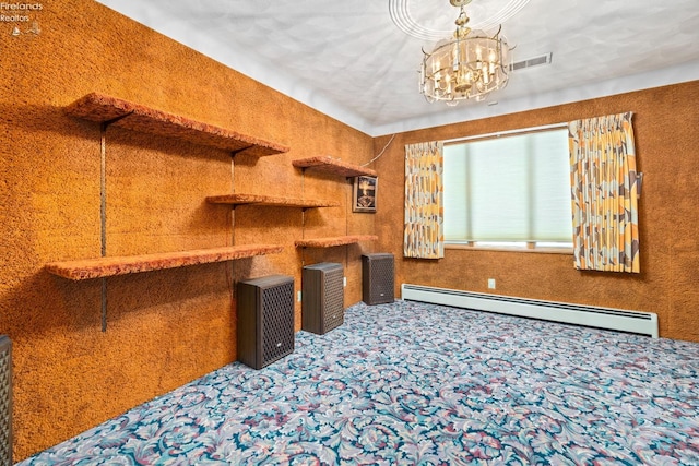 interior space with a chandelier, carpet, and a baseboard heating unit