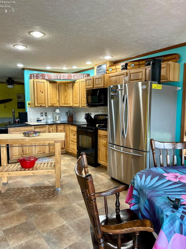 kitchen with sink, decorative backsplash, black appliances, and light tile patterned floors