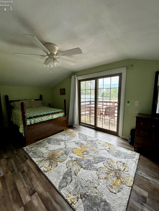 bedroom featuring vaulted ceiling, ceiling fan, access to exterior, and hardwood / wood-style flooring