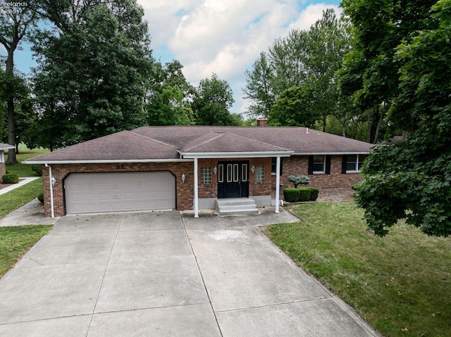 ranch-style house with a garage and a front lawn