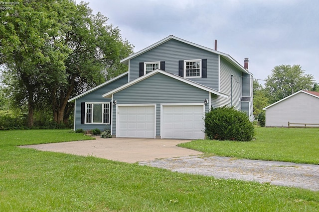 view of front of home with a garage and a front yard