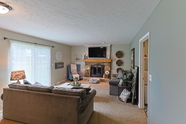 living room featuring a stone fireplace, light carpet, and a textured ceiling