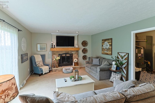 carpeted living room featuring a fireplace and a textured ceiling