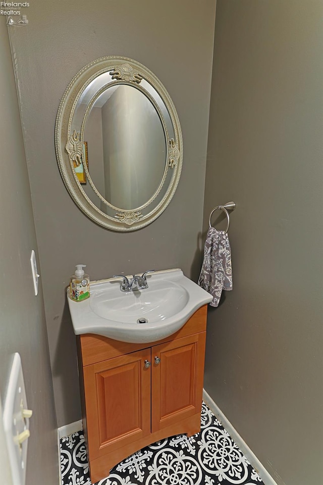 bathroom with tile patterned floors and vanity