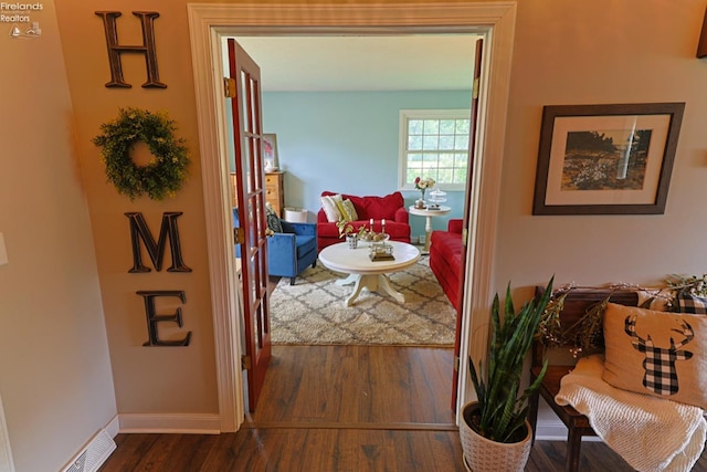 hallway with dark wood-type flooring