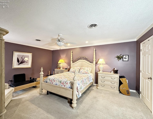 carpeted bedroom with ceiling fan and a textured ceiling