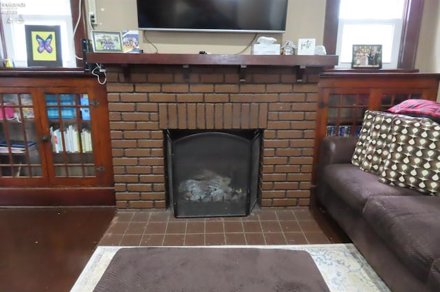 interior details featuring a brick fireplace