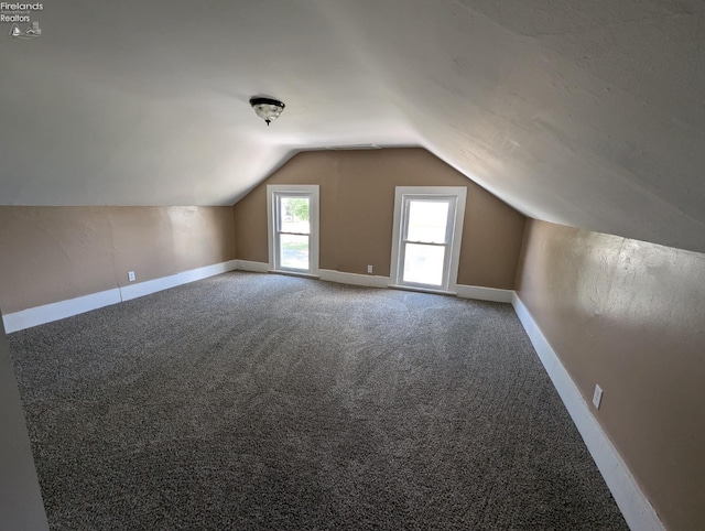 bonus room featuring carpet and lofted ceiling