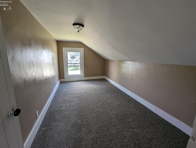 bonus room featuring lofted ceiling and carpet floors