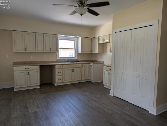 kitchen with ceiling fan, sink, and dark hardwood / wood-style flooring