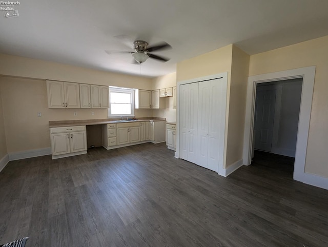 kitchen featuring white cabinets, sink, dark hardwood / wood-style floors, and ceiling fan